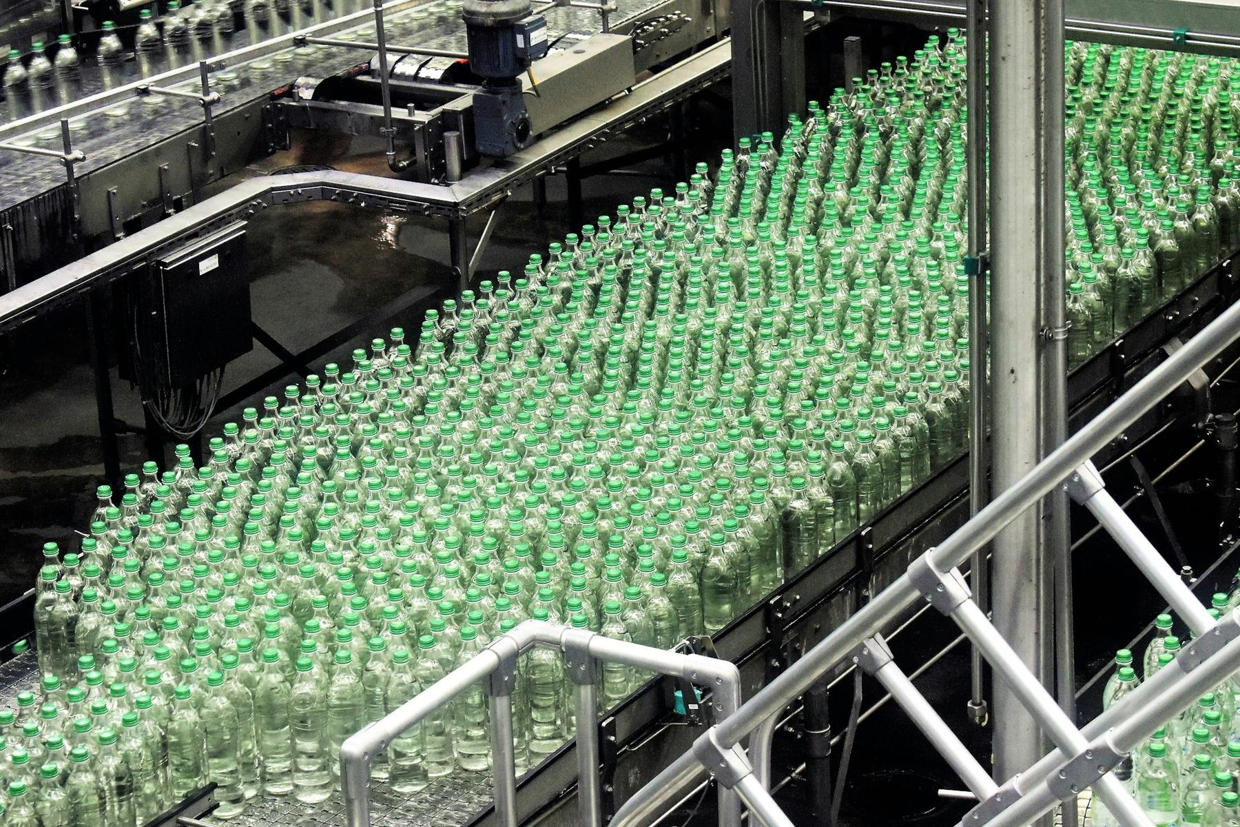 Glass bottles moving along a bottling line
